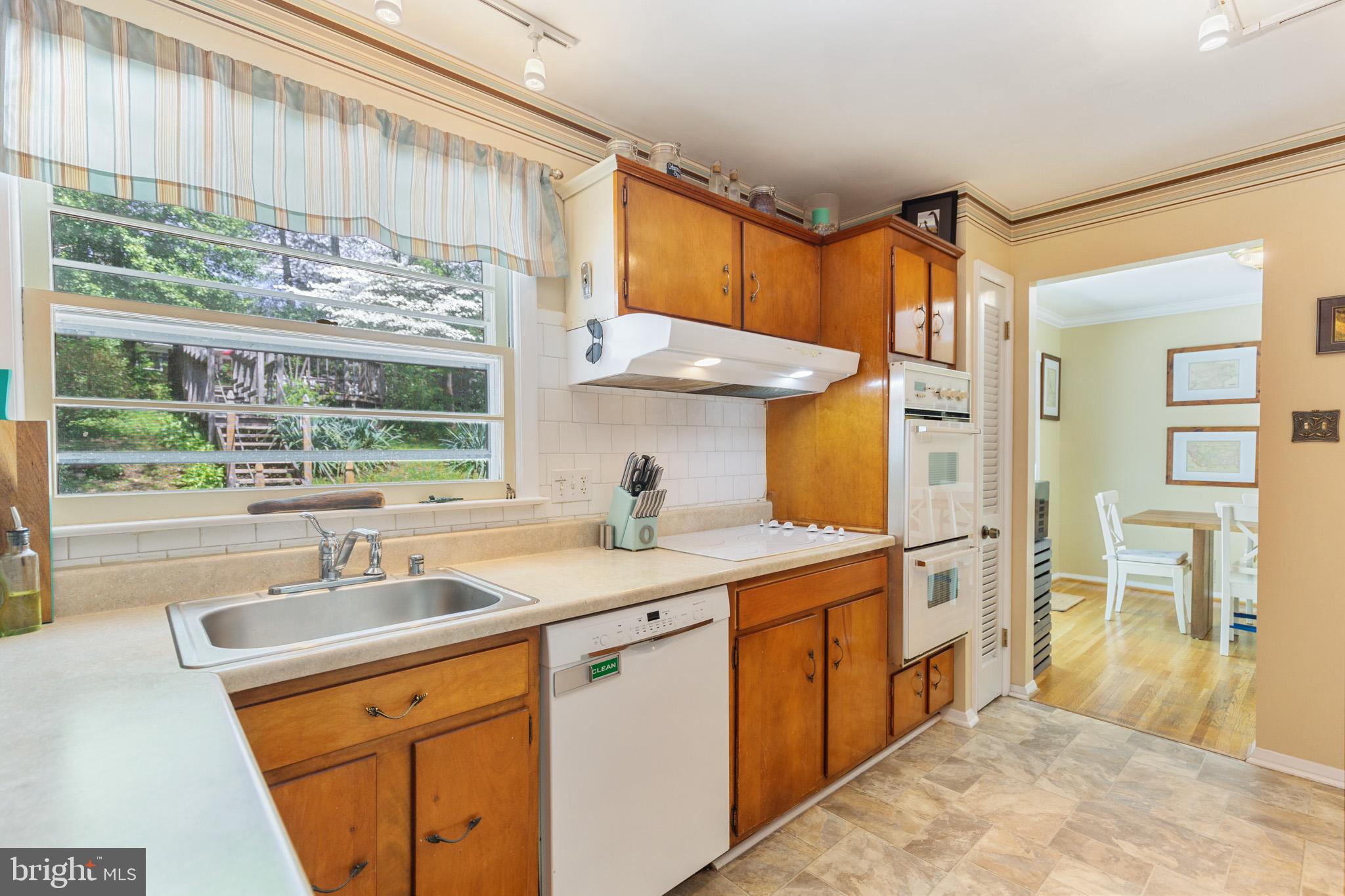 7020 Hadlow Drive Springfield, VA 22152 - Photo 4 of 29 a kitchen that has a sink and a large window