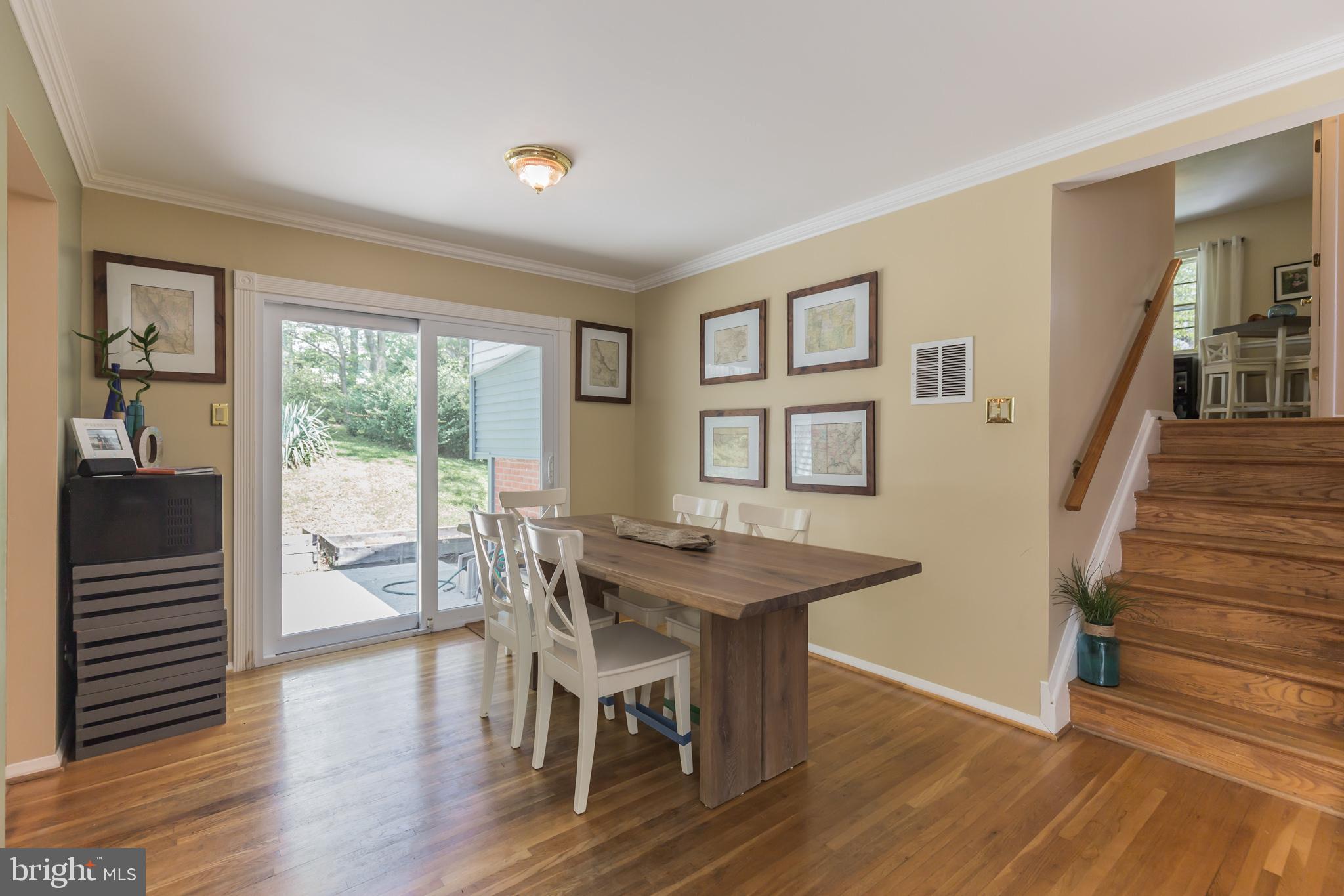 7020 Hadlow Drive Springfield, VA 22152 - Photo 9 of 29 a view of a dining room with furniture window and wooden floor