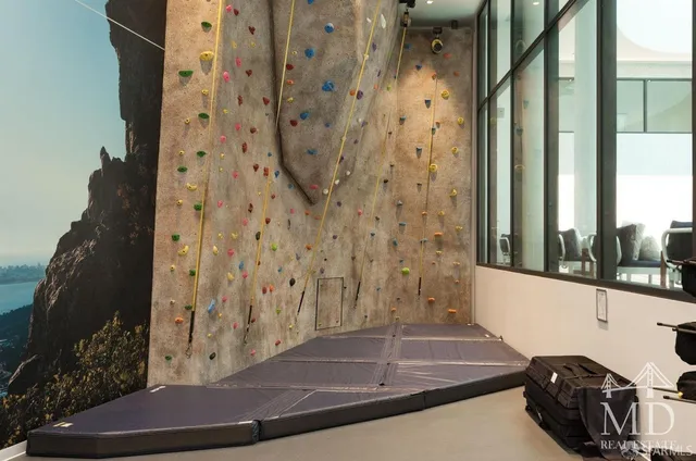 a view of a living room with gym equipment