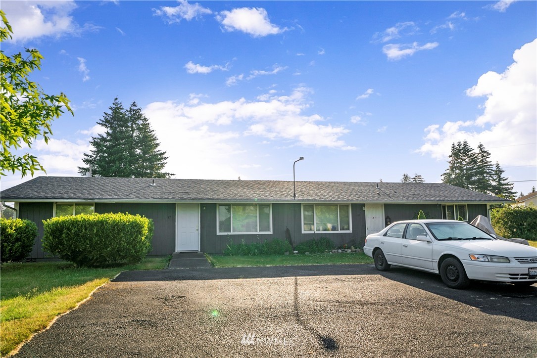 6601 198th Way Southwest Rochester, WA 98579 - Photo 8 of 10 a view of a car parked in front of a house