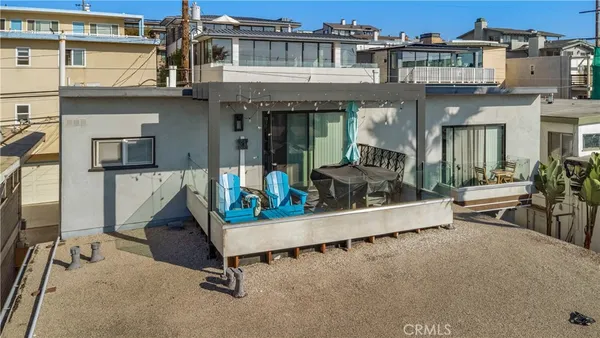 an arial view of a building with sitting area