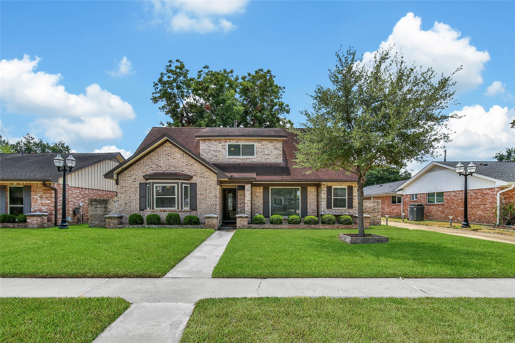 This Beautiful Exterior Features New Two-Tone Paint, Sprinkler System, and Classic Landscape. And, These are Just a few of the Exterior Upgrades!