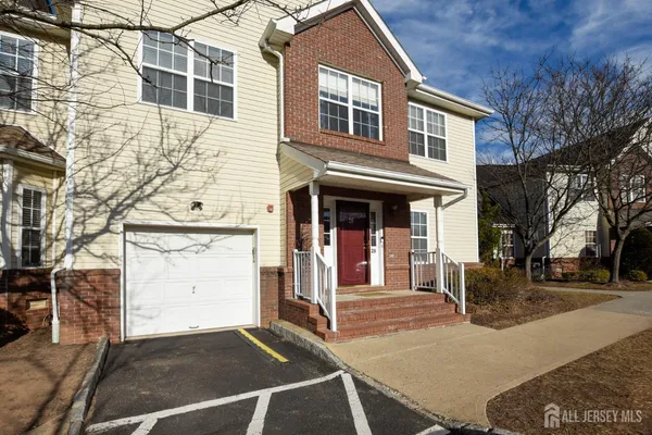 a front view of a house with a garage
