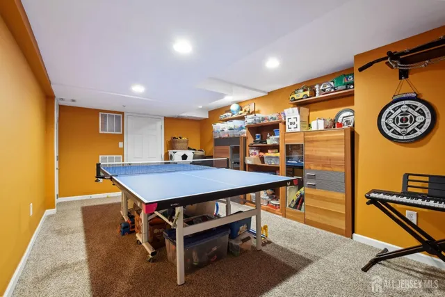 a living room with furniture gym equipment and a flat screen tv