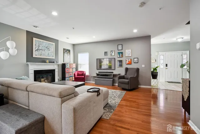 a living room with furniture or couch and a fireplace