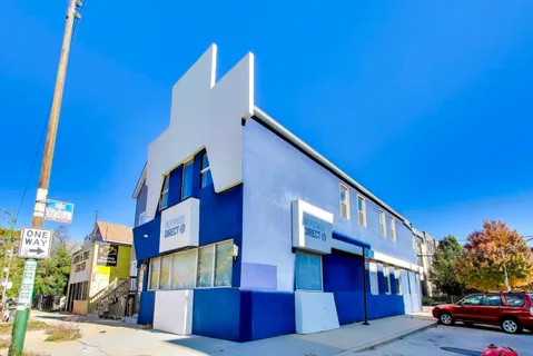 a view of a building with a street