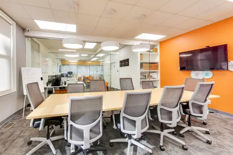 a dining room with furniture a window and kitchen view