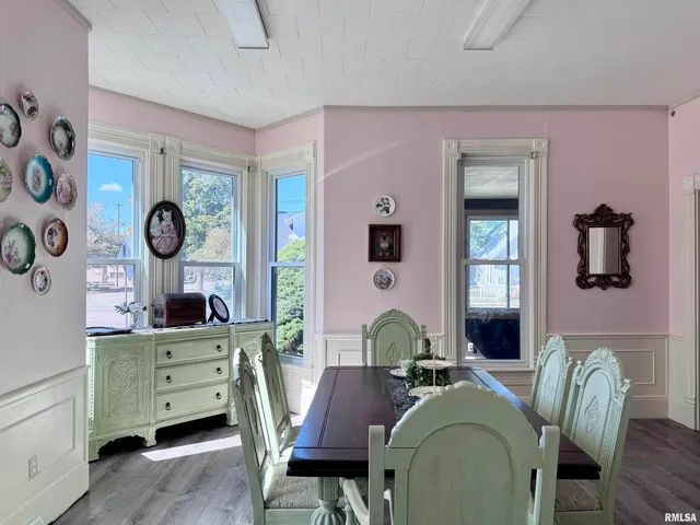 a dining room with furniture and window