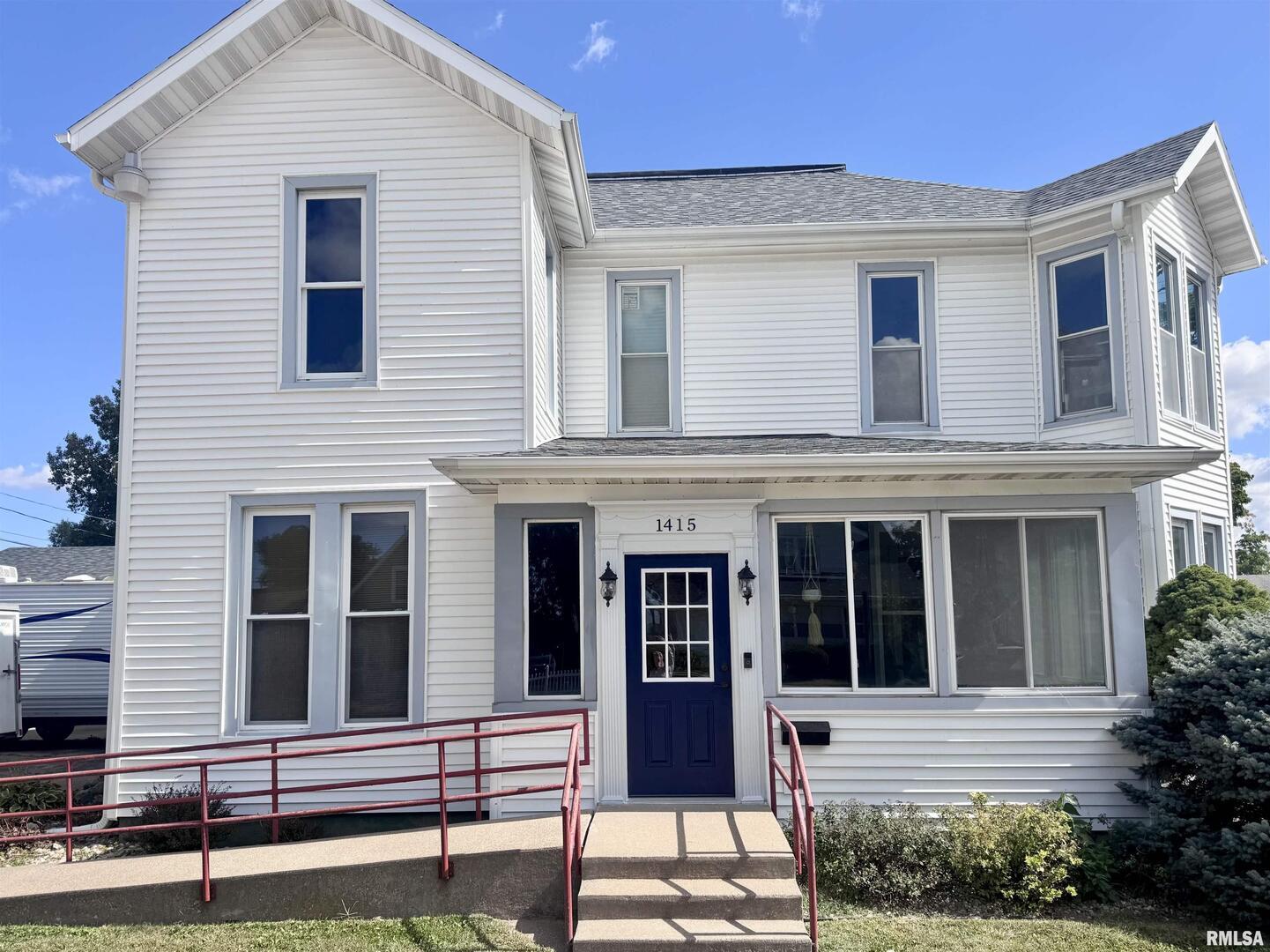 1415 4th Street Fulton, IL 61252 - Photo 2 of 58 a view of brick house with large windows