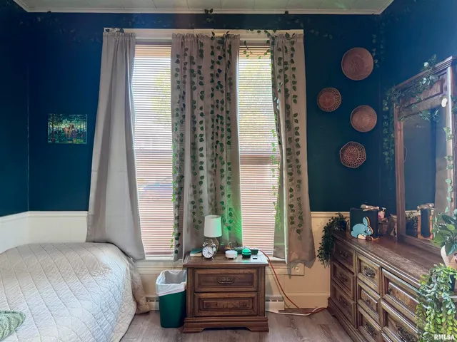 a living room with furniture and a book shelf