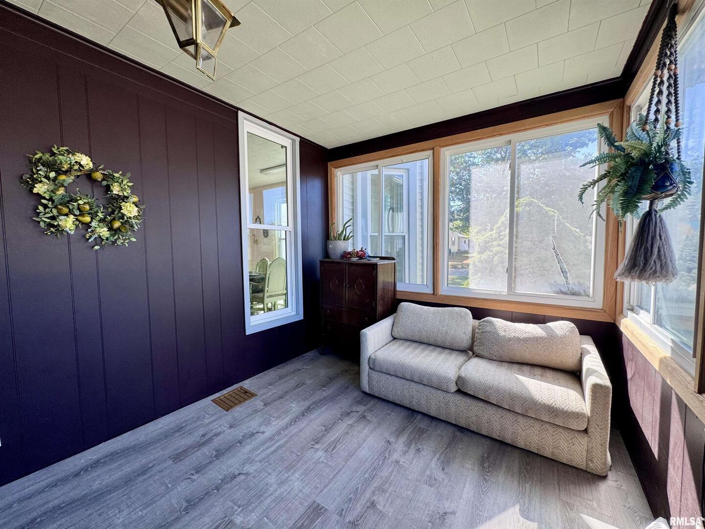 1415 4th Street Fulton, IL 61252 - Photo 29 of 58 a living room with furniture and a large window