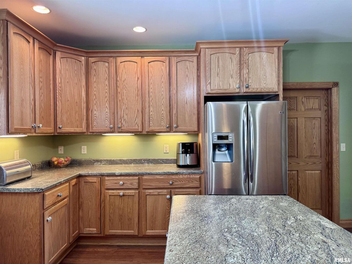 1415 4th Street Fulton, IL 61252 - Photo 36 of 58 a kitchen with stainless steel appliances granite countertop a refrigerator sink and cabinets
