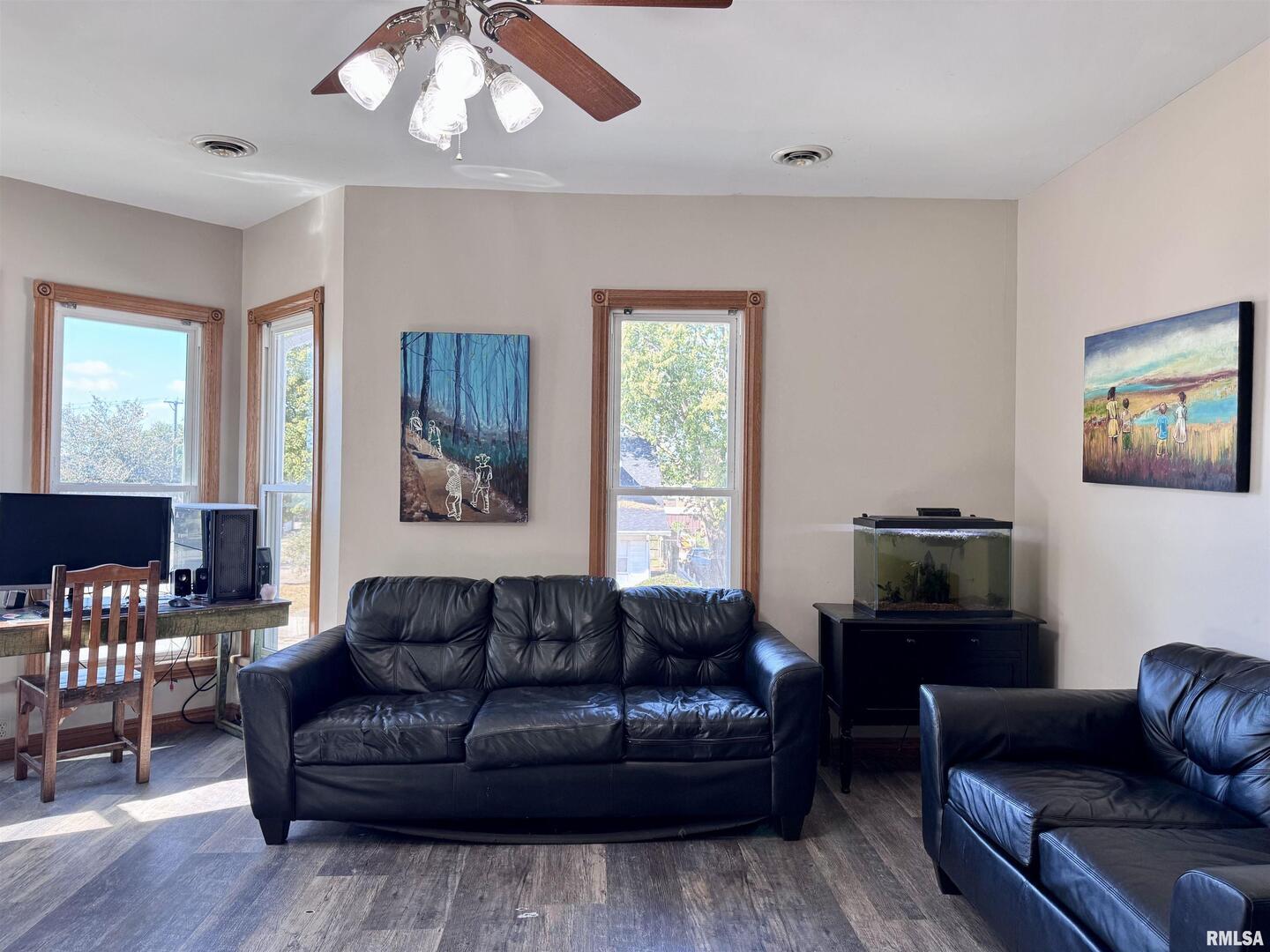 1415 4th Street Fulton, IL 61252 - Photo 40 of 58 a living room with furniture and a flat screen tv