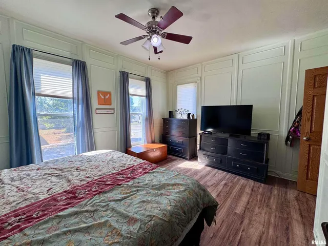 a bedroom with a bed and a dresser