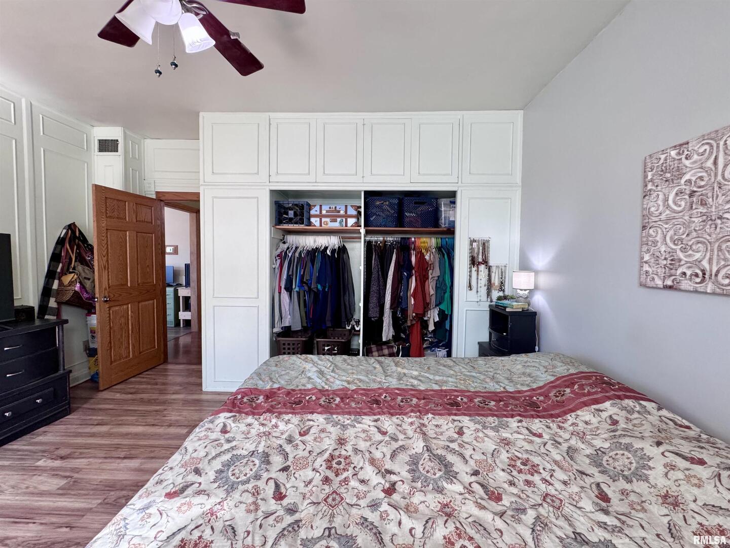 1415 4th Street Fulton, IL 61252 - Photo 46 of 58 a bed room with a bed and a walk in closet