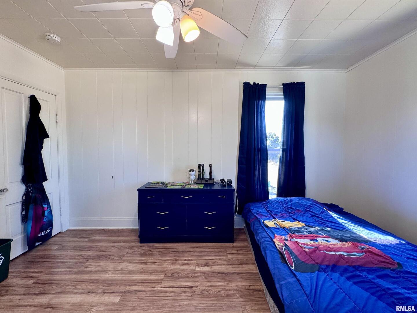 1415 4th Street Fulton, IL 61252 - Photo 47 of 58 a bedroom with a bed and a flat screen tv