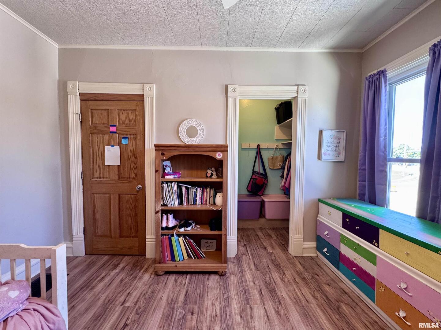 1415 4th Street Fulton, IL 61252 - Photo 50 of 58 a room with furniture and a book shelf