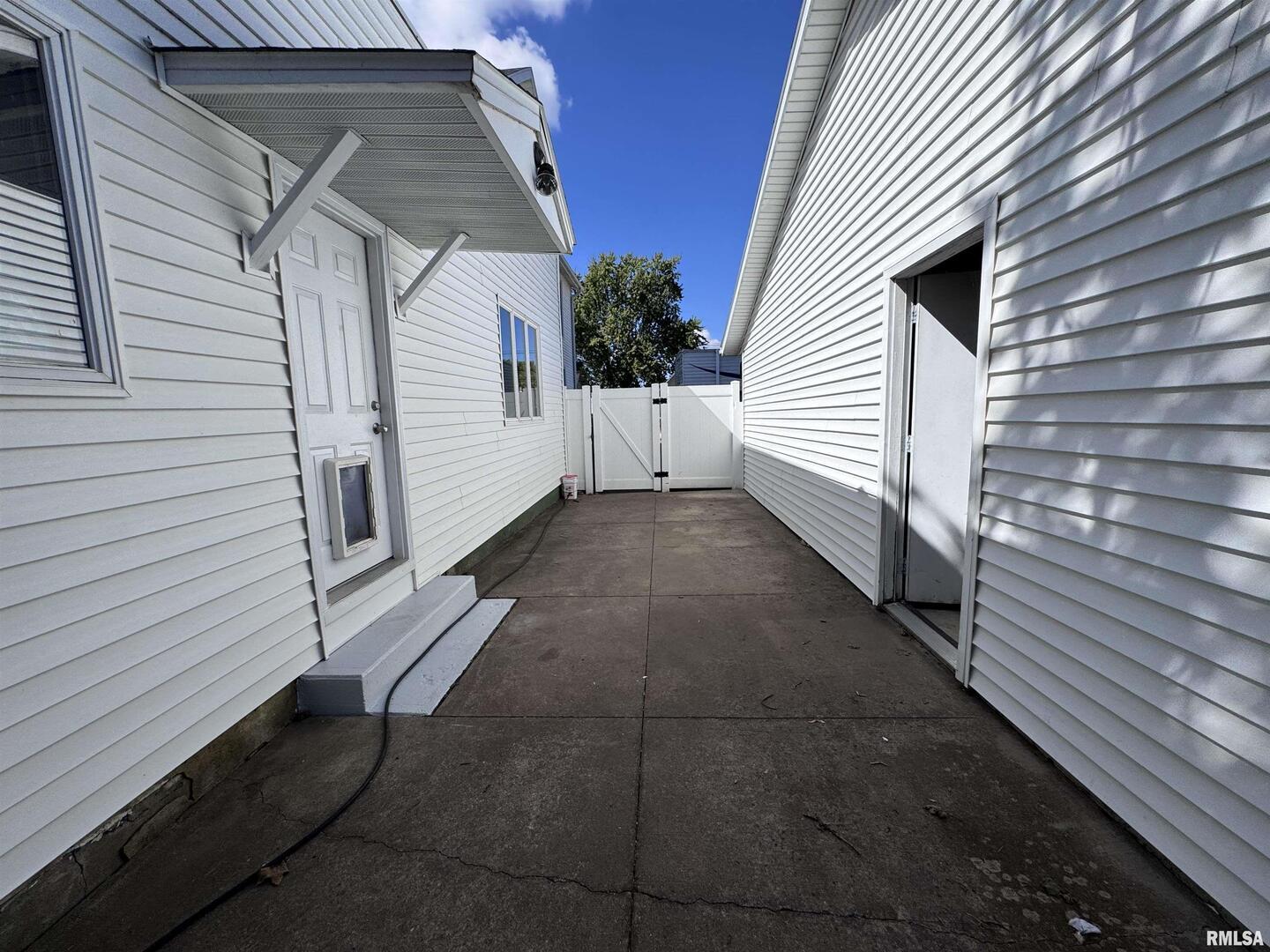 1415 4th Street Fulton, IL 61252 - Photo 7 of 58 a view of a house with a yard