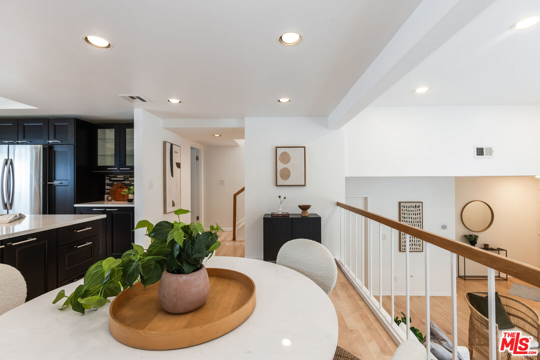 13230 Fiji Way, Unit B Marina del Rey, CA 90292 - Photo 13 of 65 a dining room with furniture and potted plant