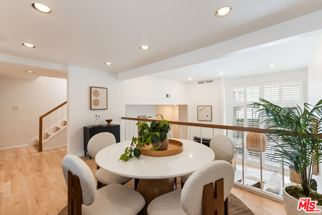 13230 Fiji Way, Unit B Marina del Rey, CA 90292 - Photo 14 of 65 a view of a dining room with furniture and wooden floor