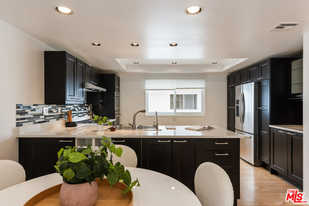 13230 Fiji Way, Unit B Marina del Rey, CA 90292 - Photo 15 of 65 a kitchen with a sink stove and refrigerator