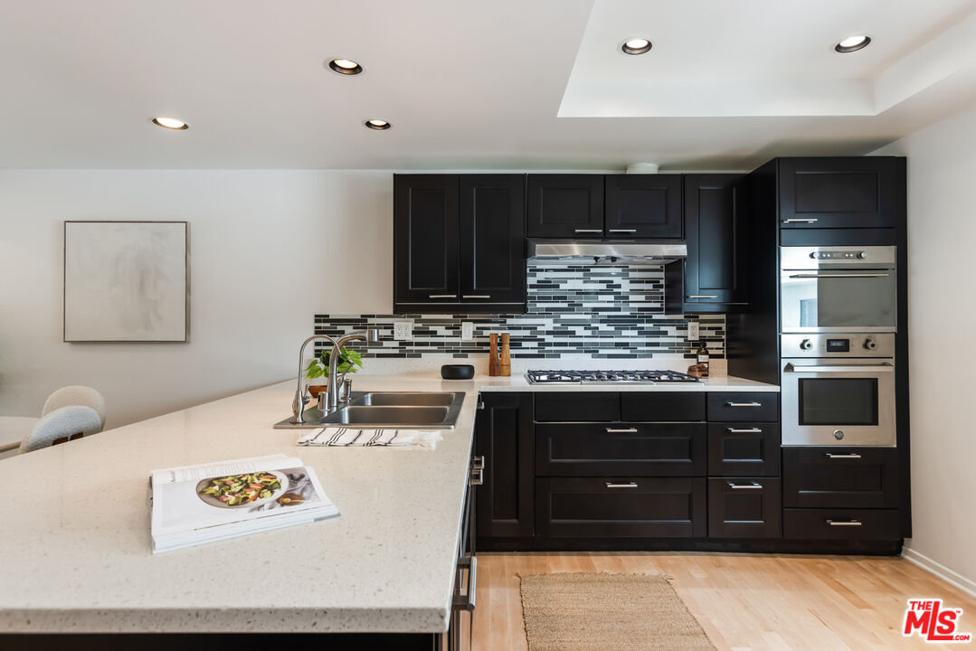 13230 Fiji Way, Unit B Marina del Rey, CA 90292 - Photo 17 of 65 a kitchen with a sink and cabinets