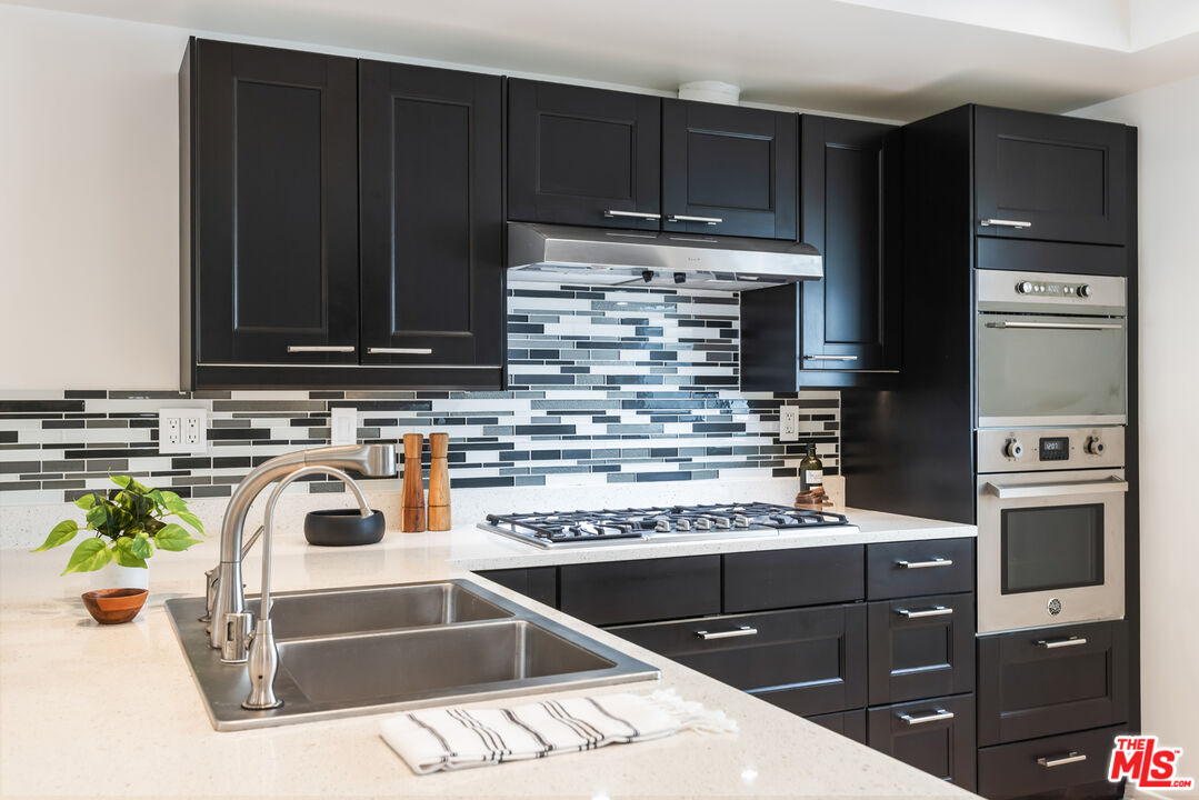 13230 Fiji Way, Unit B Marina del Rey, CA 90292 - Photo 18 of 65 a kitchen with a sink and a stove top oven