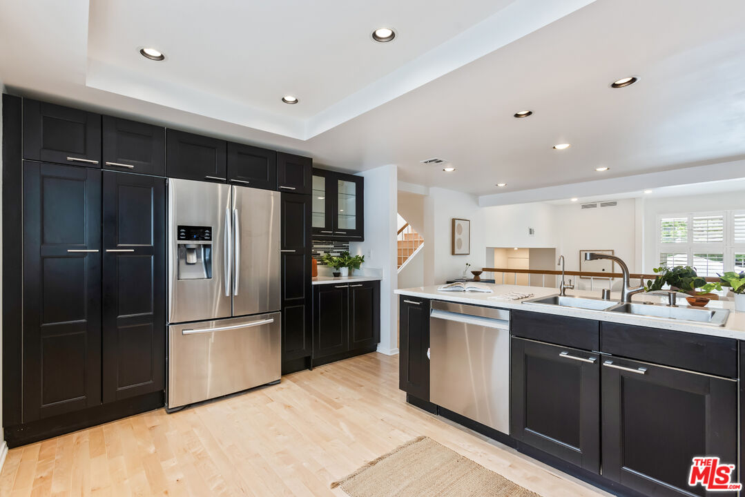 13230 Fiji Way, Unit B Marina del Rey, CA 90292 - Photo 19 of 65 a kitchen with stainless steel appliances granite countertop a refrigerator and a sink