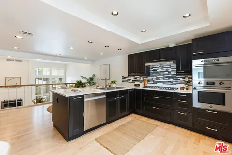 a bathroom with a sink mirror and toilet