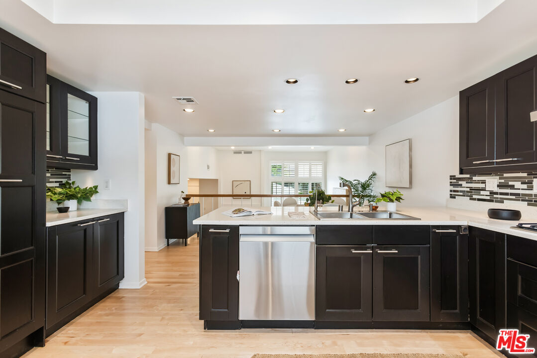 13230 Fiji Way, Unit B Marina del Rey, CA 90292 - Photo 22 of 65 a kitchen with stainless steel appliances granite countertop a stove a sink dishwasher and a refrigerator