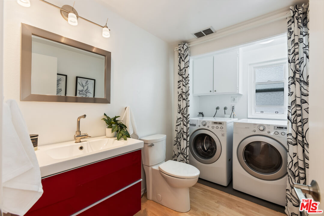 13230 Fiji Way, Unit B Marina del Rey, CA 90292 - Photo 23 of 65 a bathroom with a sink mirror and toilet