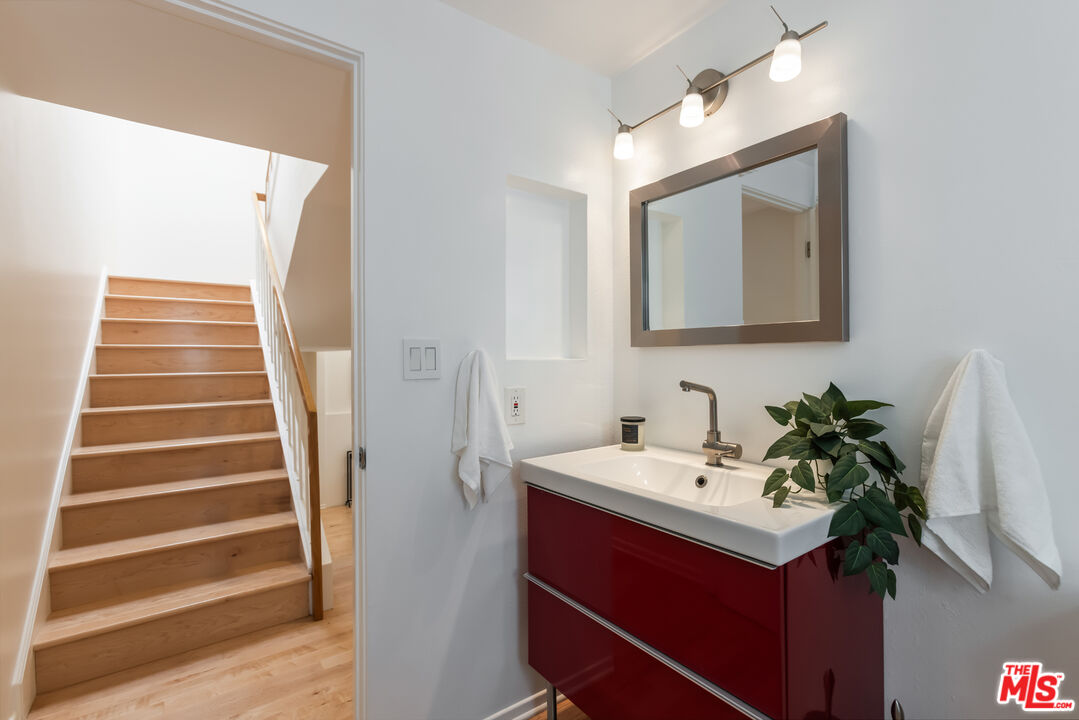 13230 Fiji Way, Unit B Marina del Rey, CA 90292 - Photo 24 of 65 a bathroom with a sink and a mirror