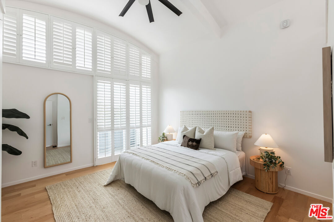 13230 Fiji Way, Unit B Marina del Rey, CA 90292 - Photo 25 of 65 a bedroom with a bed and a large window