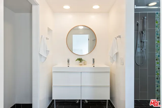 a bathroom with a shower and toilet