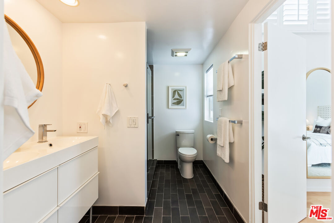 13230 Fiji Way, Unit B Marina del Rey, CA 90292 - Photo 32 of 65 a bathroom with a sink and a mirror