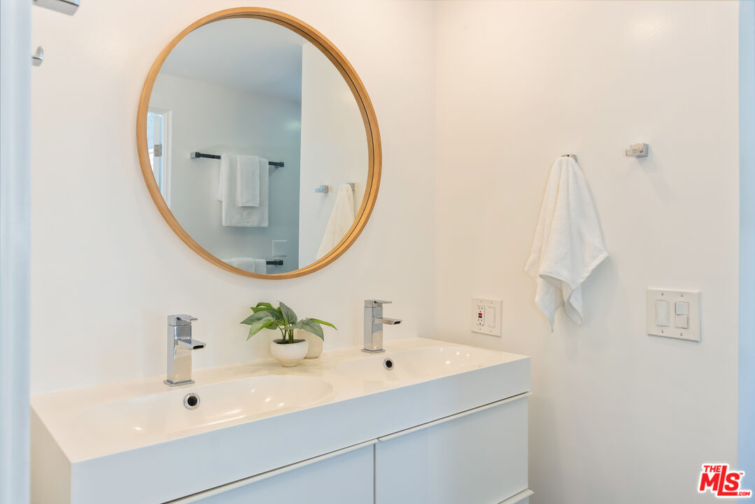 13230 Fiji Way, Unit B Marina del Rey, CA 90292 - Photo 33 of 65 a bathroom with a sink and a mirror