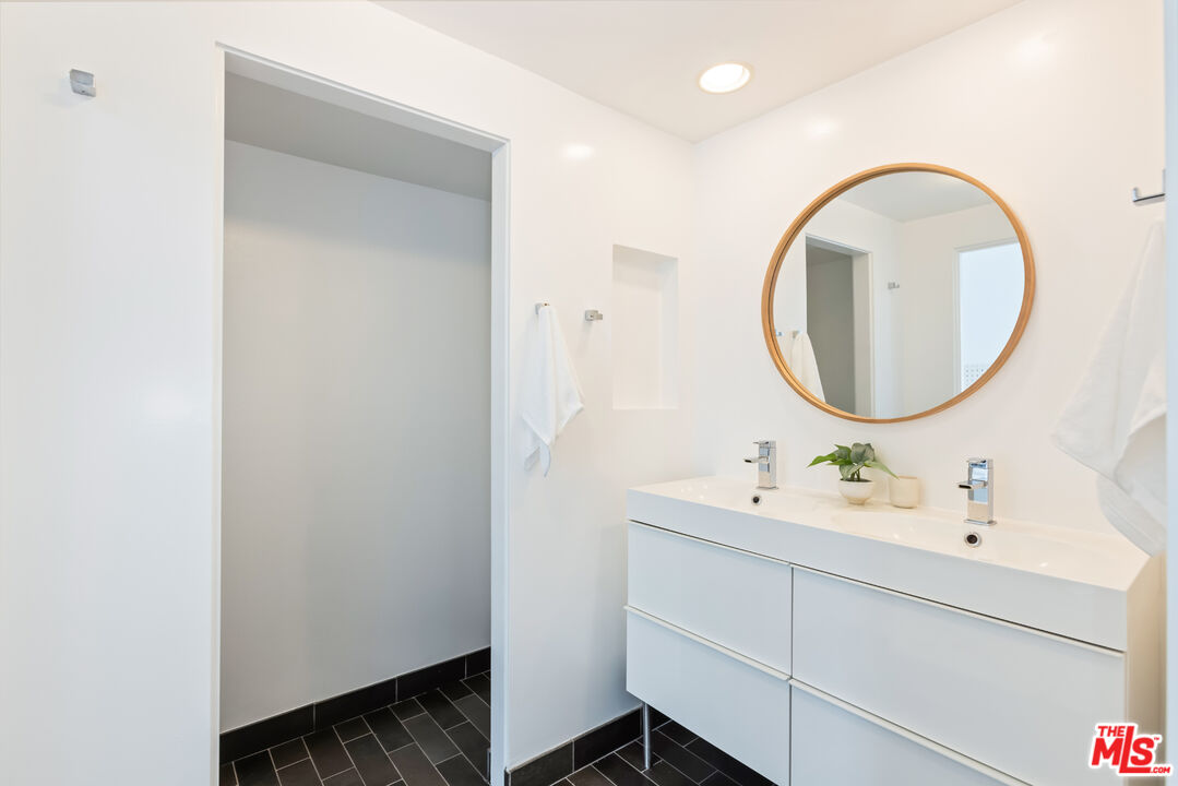 13230 Fiji Way, Unit B Marina del Rey, CA 90292 - Photo 35 of 65 a bathroom with a sink and a mirror