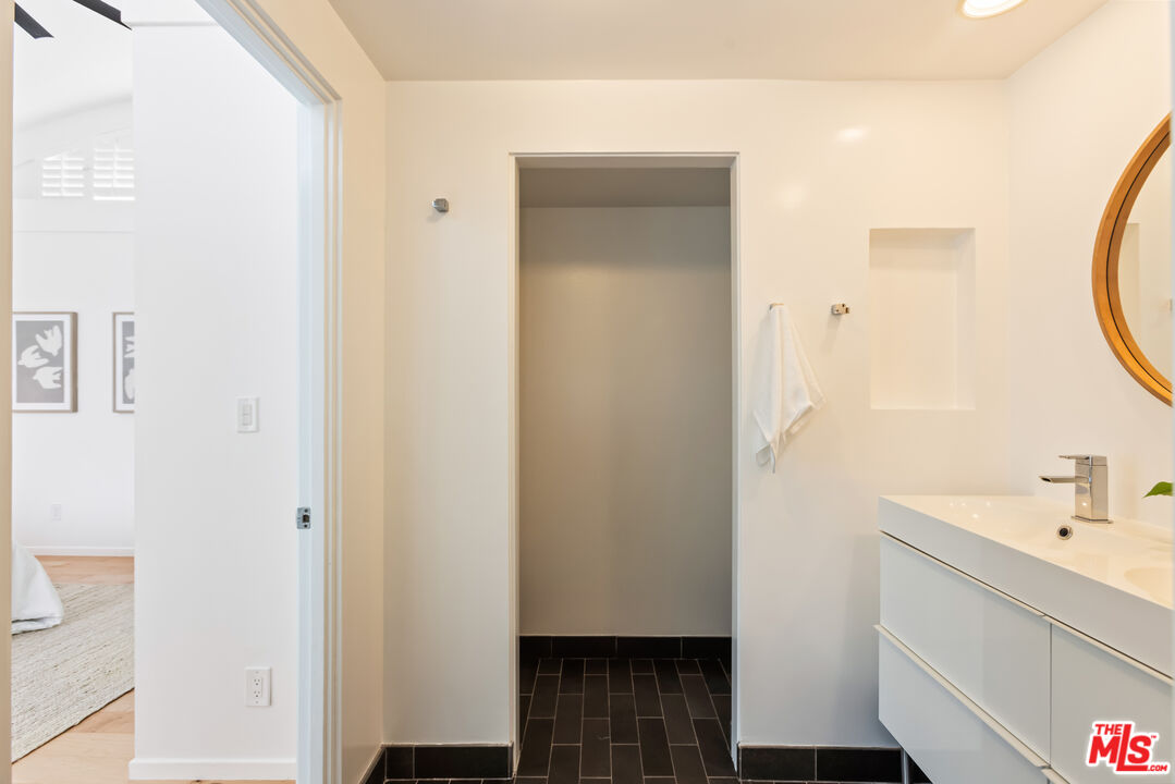 13230 Fiji Way, Unit B Marina del Rey, CA 90292 - Photo 36 of 65 a bathroom with a sink and a mirror