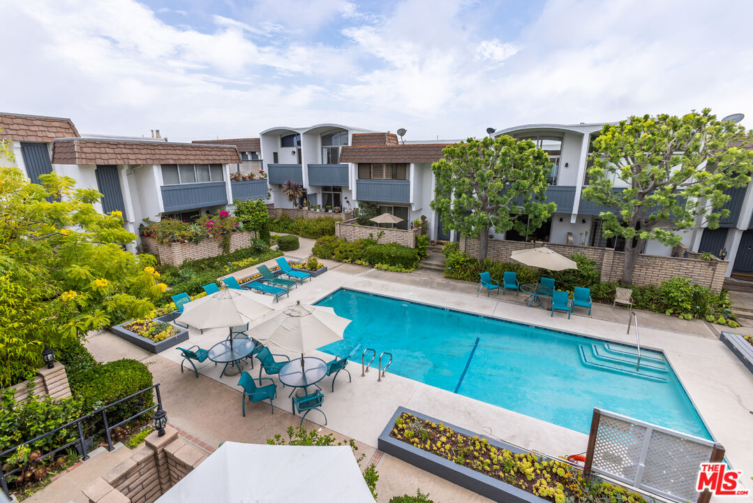 13230 Fiji Way, Unit B Marina del Rey, CA 90292 - Photo 40 of 65 a view of a patio with couches table and chairs and potted plants