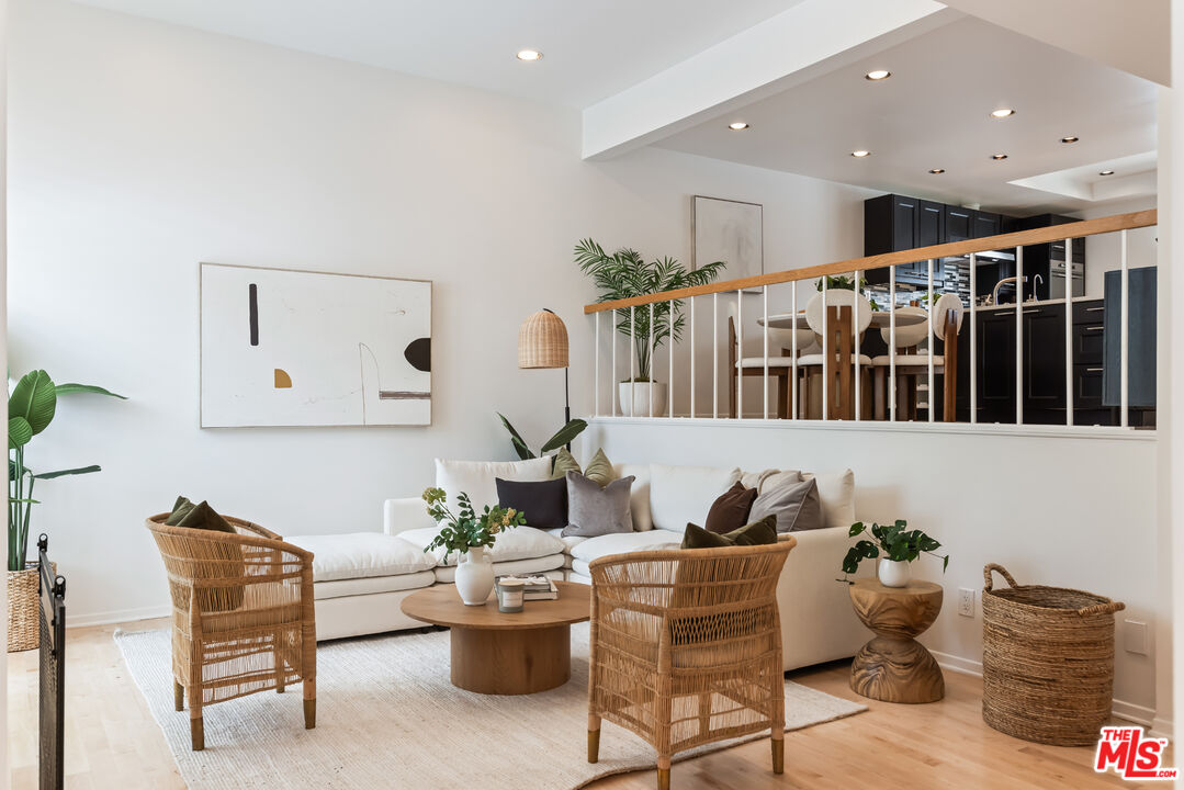 13230 Fiji Way, Unit B Marina del Rey, CA 90292 - Photo 4 of 65 a living room with furniture and a potted plant