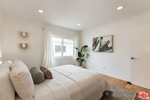 a bedroom with a bed and a cabinets