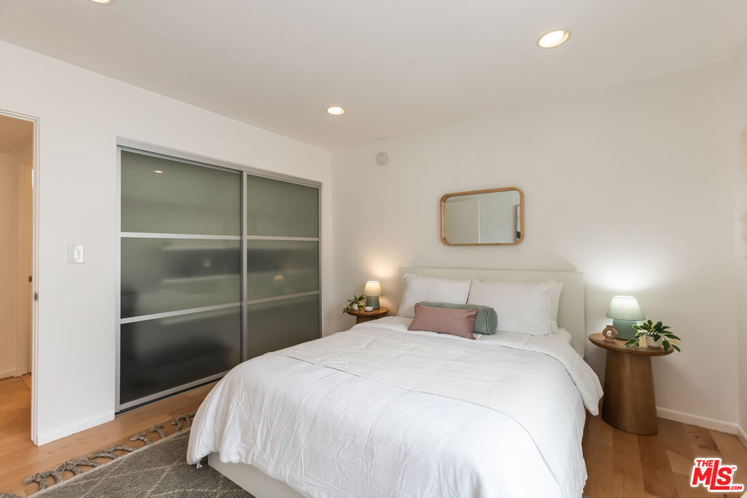 13230 Fiji Way, Unit B Marina del Rey, CA 90292 - Photo 43 of 65 a bedroom with a bed and a potted plant