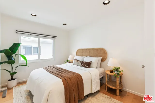 a view of a patio with chairs and table under an umbrella