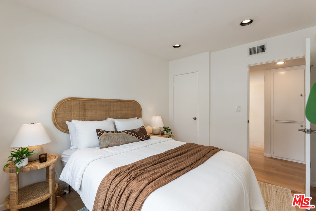 13230 Fiji Way, Unit B Marina del Rey, CA 90292 - Photo 48 of 65 a bedroom with a bed and a painting