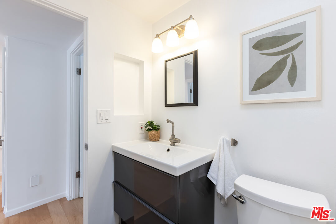 13230 Fiji Way, Unit B Marina del Rey, CA 90292 - Photo 52 of 65 a bathroom with a toilet sink and mirror