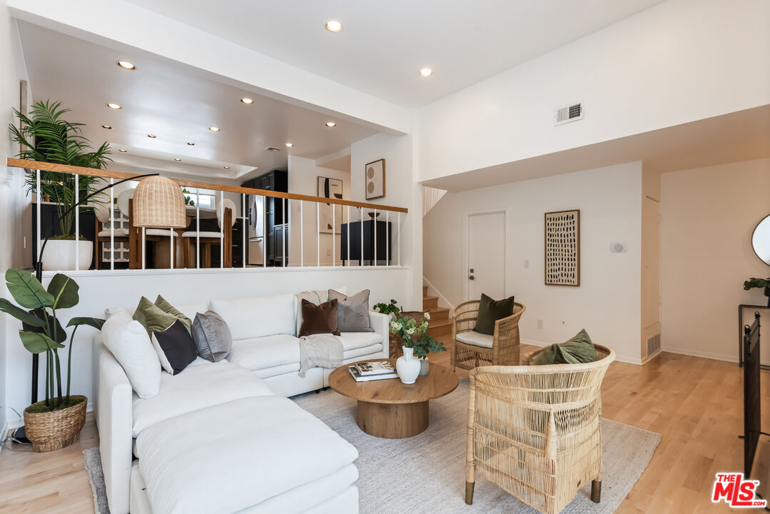 13230 Fiji Way, Unit B Marina del Rey, CA 90292 - Photo 6 of 65 a living room with furniture and a large window