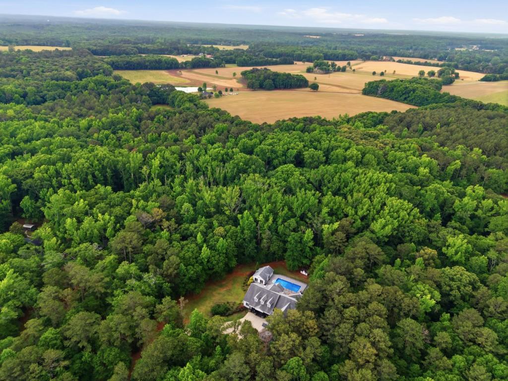 582 Knox Chapel Road Social Circle, GA 30025 - Photo 43 of 49 an aerial view of residential houses with outdoor space and trees