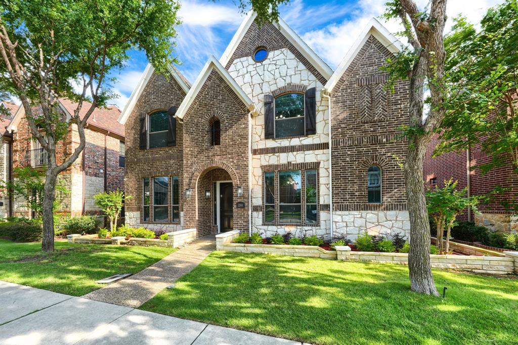 2246 Longview Road Irving, TX 75063 - Photo 2 of 40 Two-story residential exterior featuring brick and stone masonry, multiple gables, and arched entryway
