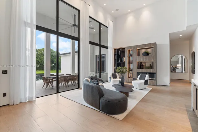 a kitchen with a table chairs stove and microwave