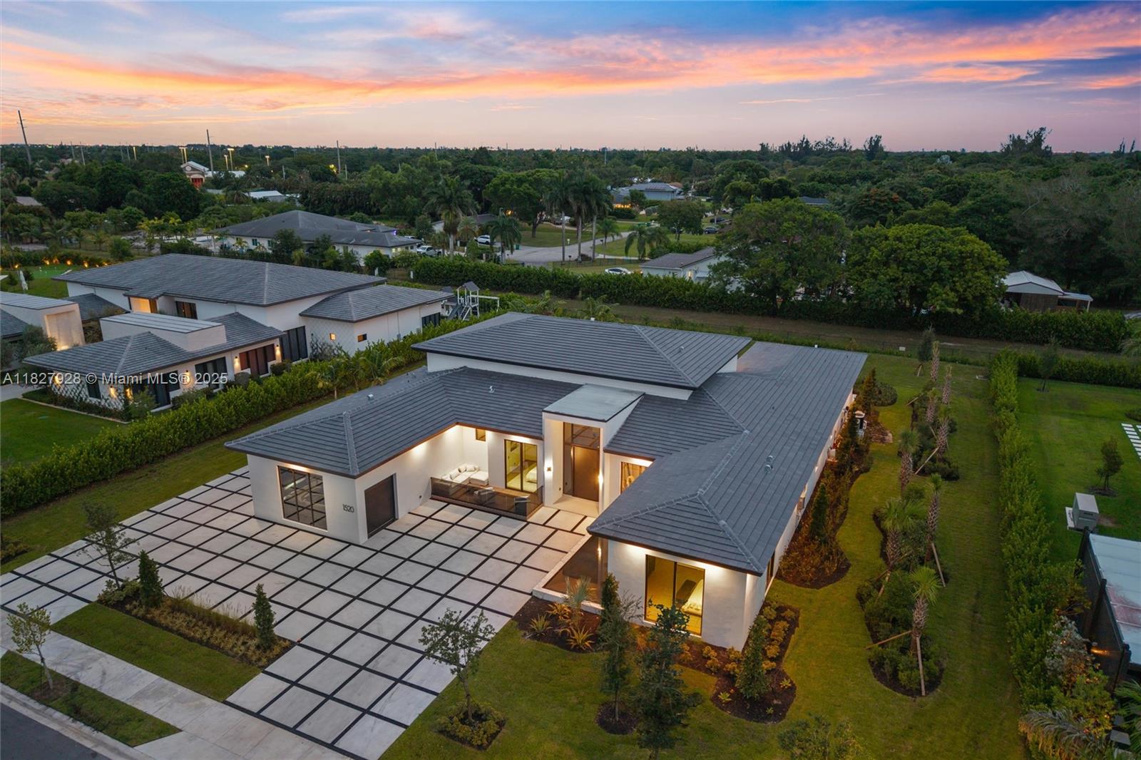 1520 Southwest 149th Terrace Fort Lauderdale, FL 33325 - Photo 2 of 80 an aerial view of a house with a garden and lake view